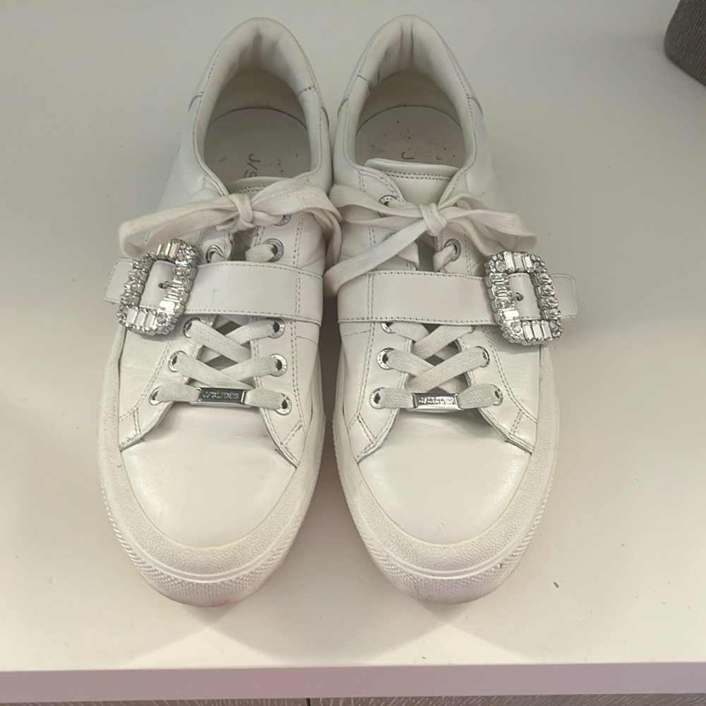 J Slides white sneaker still has miles to go